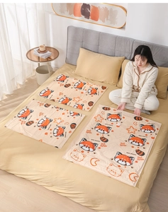 Set of three vacuum storage bags with cute red panda print shown in a cozy bedroom setting
