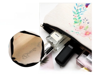 Detailed internal capacity of floral linen makeup bag showing cosmetics storage space