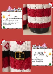 Close-up of a festive knit Christmas bottle cover with red stripes and a gold buckle belt