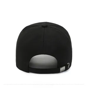 Rear view of black cotton baseball cap showing adjustable metal strap and stitching