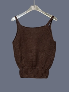 Detailed view of dark coffee knitted camisole with thick texture and ribbed hem detail