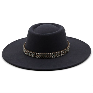 Detail of wide brim felt fedora hat featuring ethnic style colorful braided band