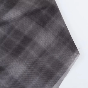 Detailed macro view of the semi-transparent grey tie-dye fine mesh fabric texture