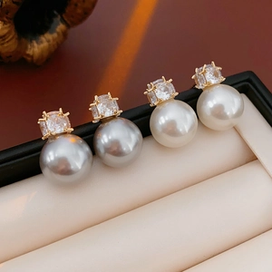 French vintage zircon and imitation pearl stud earrings set in a white display box