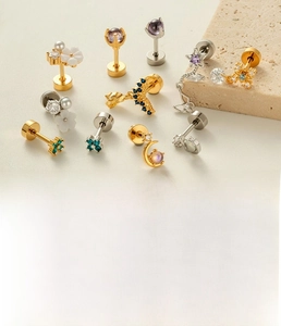 Macro detail of various labret studs with moon and star shapes on 1.2x6mm steel bars