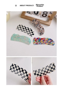 Detail of wavy acetate hair combs in marble and checkered patterns for detangling hair