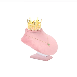 Close-up of pink velvet jewelry necklace display bust showing fine soft texture
