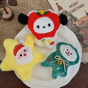 Plush Christmas tree ornaments including Santa and star characters on a white decorative plate
