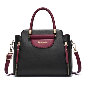 Elegant black and wine red leather handbag with top handle and shoulder strap for women