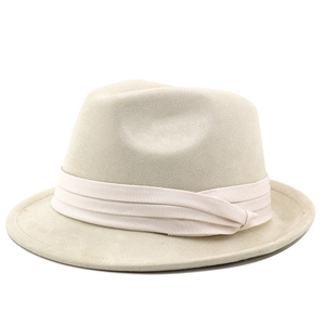 Close-up of beige suede fedora hat with matching ribbon band on white background