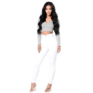 Detail showing high-waist white skinny jeans with ribbed grey long sleeve crop top