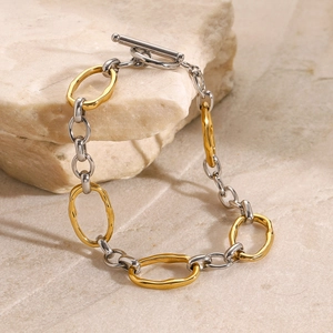 Two-tone gold and silver irregular link bracelet with OT toggle clasp on stone