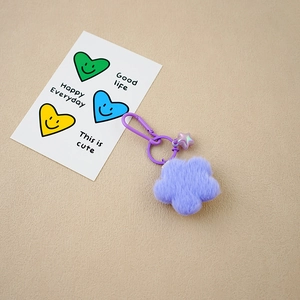 Cute purple plush flower keychain with iridescent star bead and matching plastic hook
