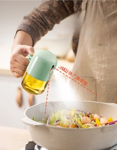 Kitchen glass oil sprayer bottle with pressure pump for even misting and cooking control.
