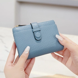 Blue short PU leather wallet detail showing the secure snap button and zipper closure