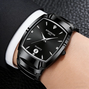 Close-up of black square quartz watch with metal strap worn with a business suit