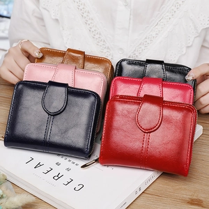 Women's minimalist short bi-fold faux leather wallet with zipper and buckle in multiple colors