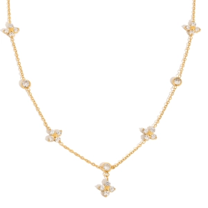 Detailed macro of 18k gold plated clover necklace with glittering zircon stones