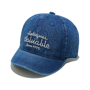 Short brim denim baseball cap with Antiques Valuable Since 1995 embroidery in navy blue