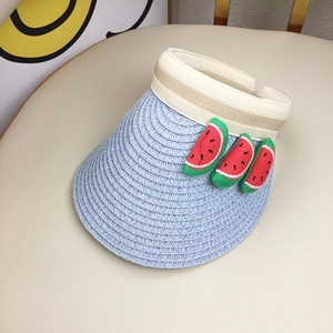 Macro shot of a blue straw sun visor for kids featuring cute 3D watermelon fruit appliques