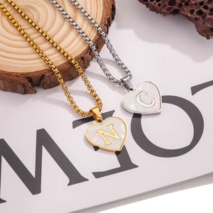 Gold and silver stainless steel heart pendants with shell inlay and custom letters