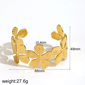 Detailed view of 18k gold stainless steel open bangle with leaf flower measurements