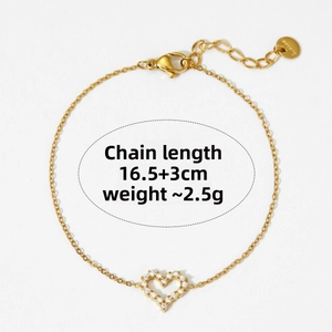 Detail of 18K gold heart bracelet with pavé cubic zirconia and adjustable lobster clasp
