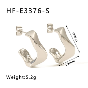 Detail view of silver twisted hoop earrings with dimensions 17mm by 19mm on white background