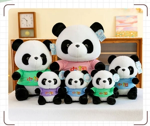 Detailed view of multiple panda plushies wearing colorful T-shirts with China print