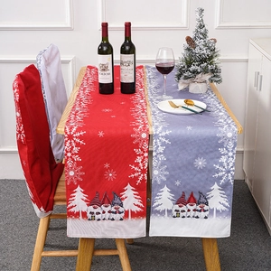 Christmas gnome table runner and chair covers with snowflake prints for holiday decor