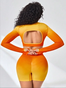 Detail of the open back U-shaped design on a seamless ribbed long sleeve yoga top