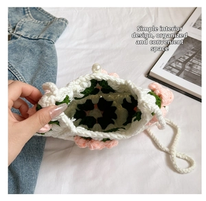 Detail view of the spacious inner compartment of this handmade crochet puff flower bag