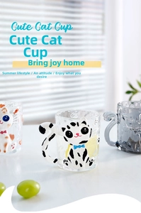 Detail of 3D cat glass cup with textured relief and a clever curved tail handle