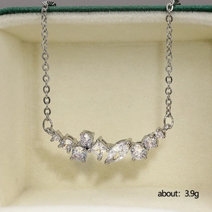 Micro-shot of a silver-plated necklace with clustered AAA zircon pendant on velvet