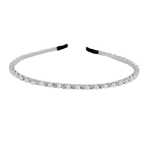 Silver metal headband set with pearls and rhinestones on a white background