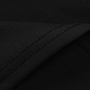 Detailed close-up showing the professional double-needle stitching on black knit fabric