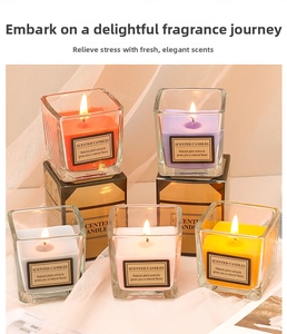 Set of five colorful square glass scented candles in various pastel candy colors