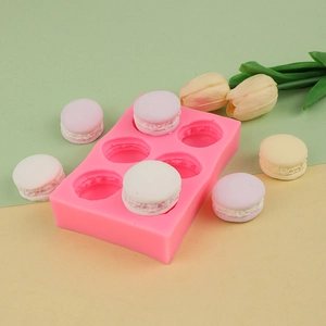 Molde de silicona 3D rosa de 6 cavidades para macaron DIY y postres en fondo colorido