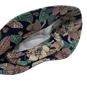 Internal view of floral sun hat showing white lining and elastic stitching details