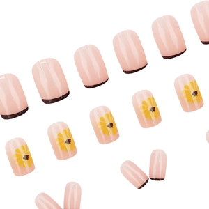 Short square press-on nails with yellow sunflower designs and brown French tips