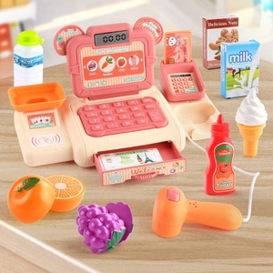 Kids toy cash register set with scanner and play food items on wooden background