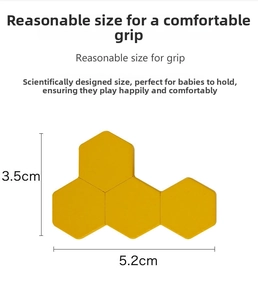Detail of yellow hexagonal wooden puzzle blocks showing dimensions for easy baby grip