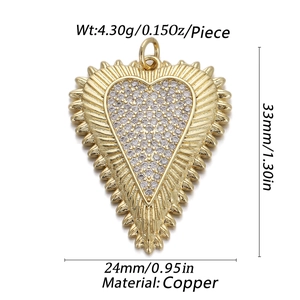 Macro shot of 18K gold plated copper heart pendant with zircon inlay and product measurements