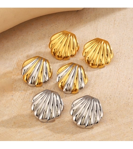 Detailed flat lay of shell-shaped stud earrings in gold and silver stainless steel