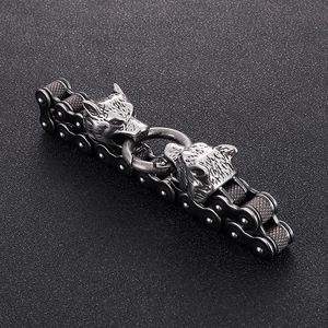 Close-up of retro punk wolf head motorcycle chain bracelet in matte silver steel