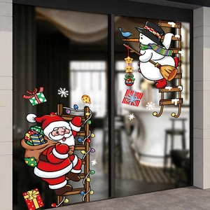 Christmas window stickers featuring Santa, snowman and snowflakes on glass doors