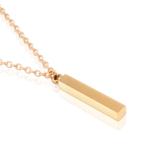 Macro view of a polished gold rectangular pillar pendant necklace on a clean white background