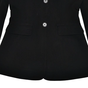 Detail of black blazer hem with two buttons and flap pockets on fabric texture