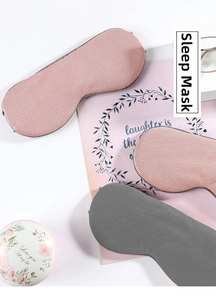 Breathable mesh sleep mask detail in pink and grey showing ergonomic contoured edges