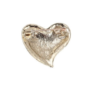 Back view of a golden heart rhinestone brooch with secure metal pin and safety clasp